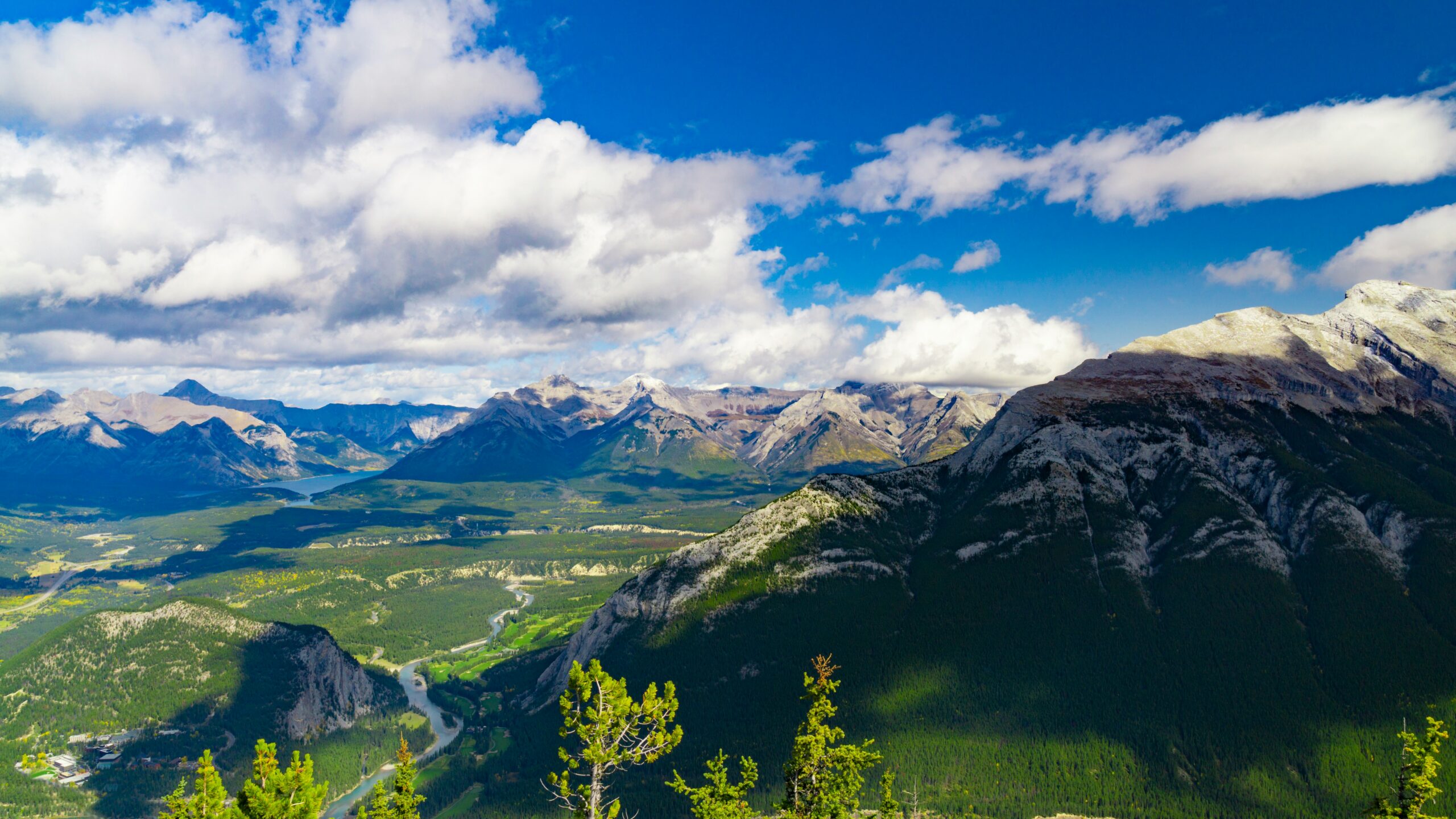 green and brown mountains under blue sky and white clouds during daytime